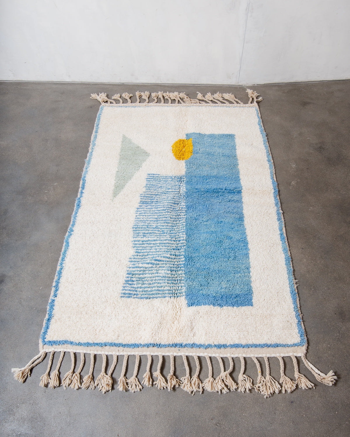 Modern, designer, handcrafted Berber rug from Morocco. Beniourain carpet with beautiful colours and patterns and fluffy wool texture.